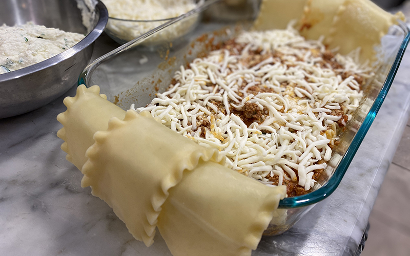 A Lasagne Dish Filled with Ragu and Mozzarella