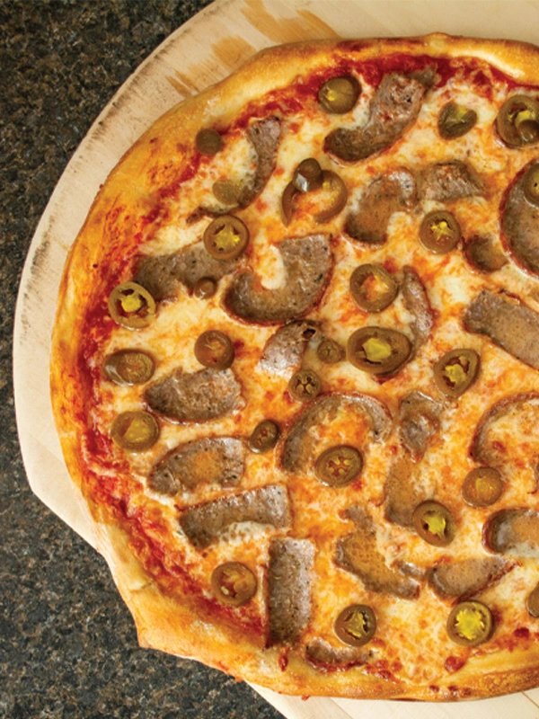 Image of Sausage Pizza, served with toppings.