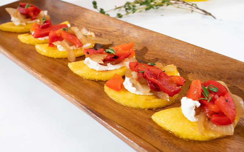 GRILLED POLENTA MOONS WITH ROASTED RED PEPPERS AND SAUTEED ONIONS
