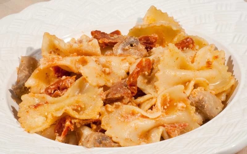 FARFALLE WITH MUSHROOMS & SUN DRIED TOMATOES