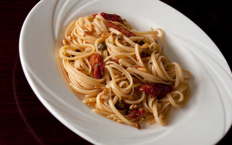PASTA WITH PIGNOLI NUTS & SUN DRIED TOMATOES