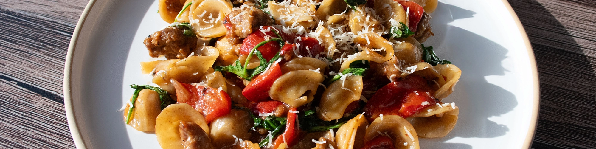 Orecchiette with Italian Sausage, Roasted Peppers & Arugula