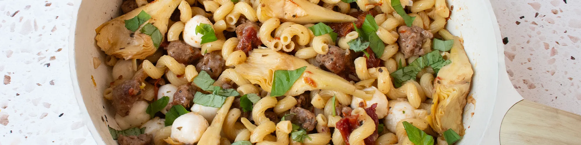 Sausage Cavatappi with Sun Dried Tomatoes and Artichokes