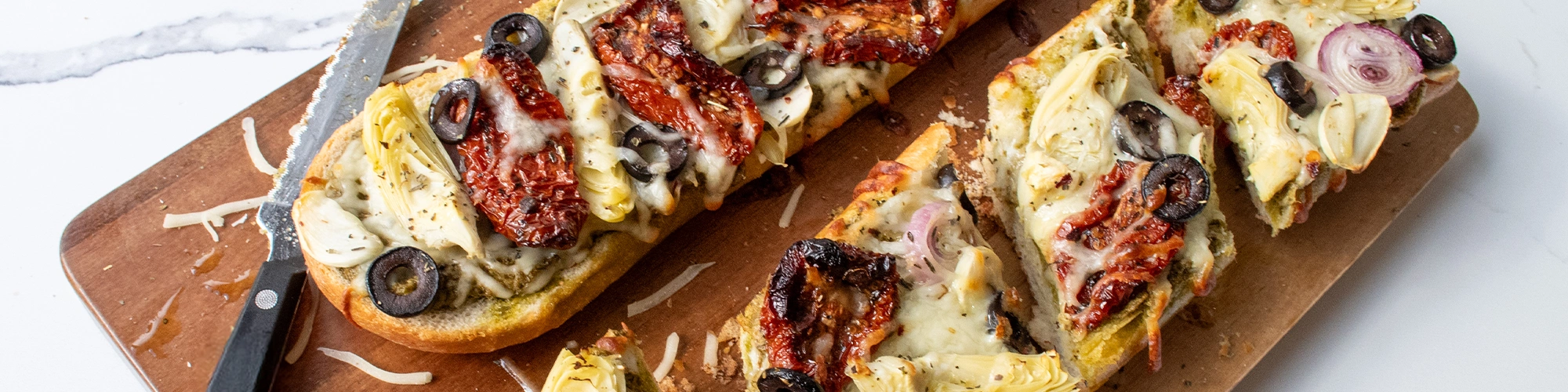 Pesto French Bread with Mediterranean Toppings