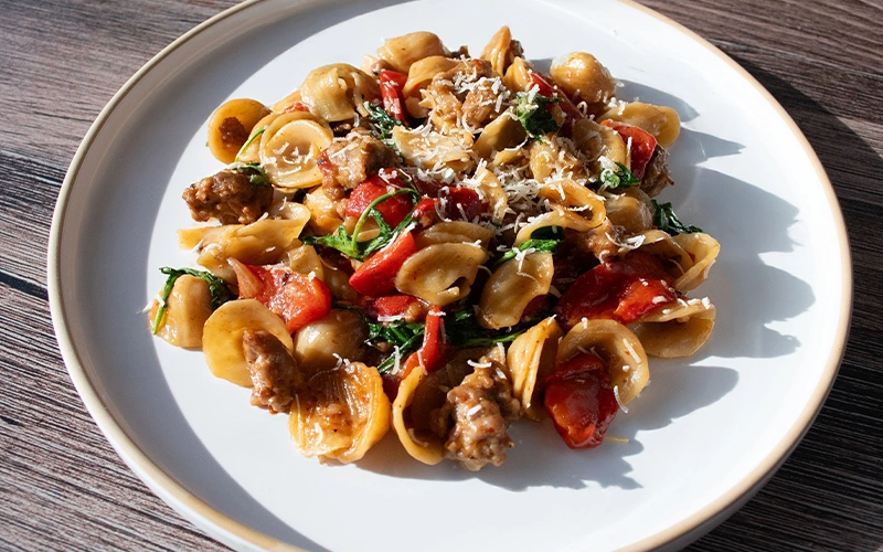Orecchiette with Italian Sausage, Roasted Peppers & Arugula