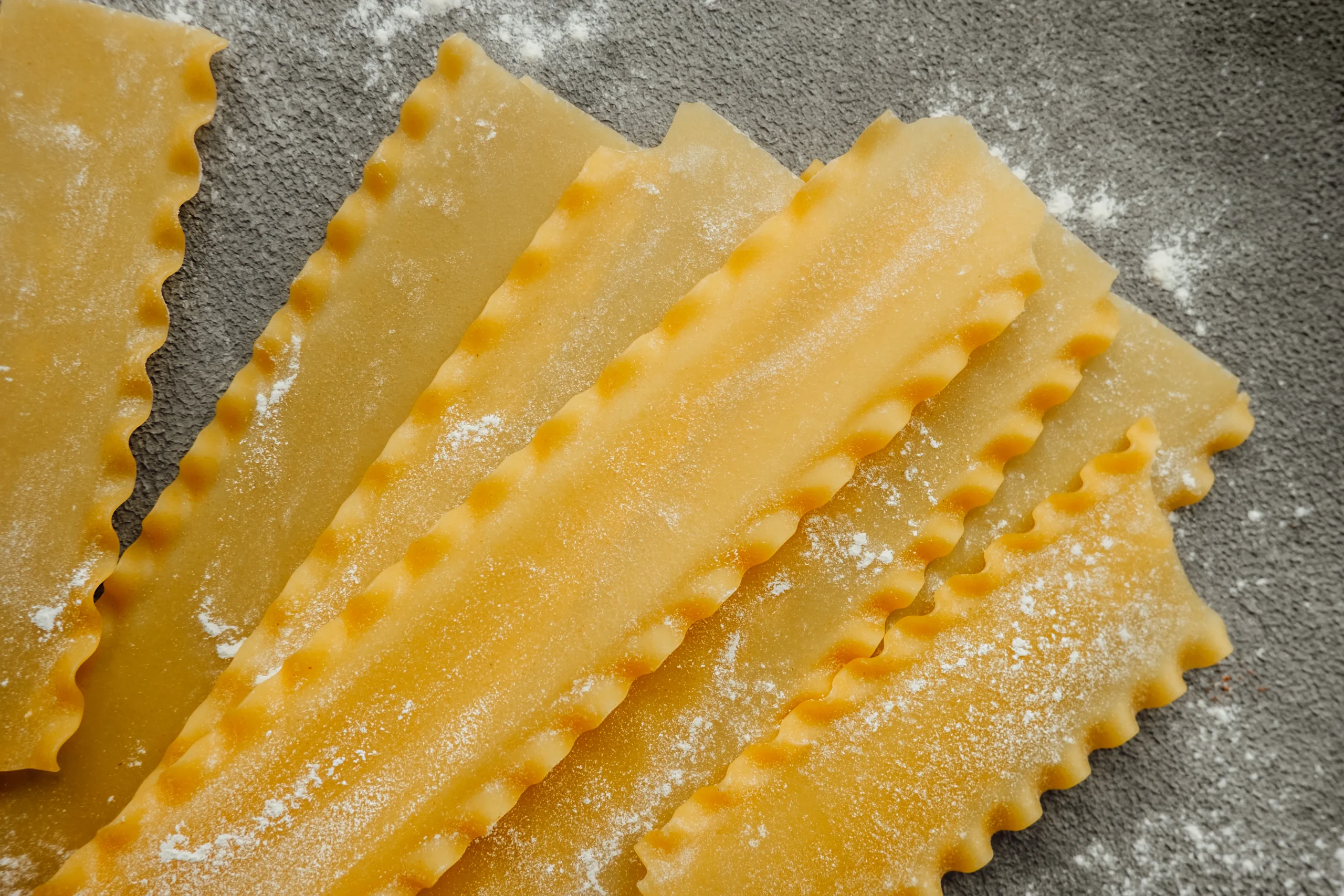 Raw hard homemade fluted lasagna sheets